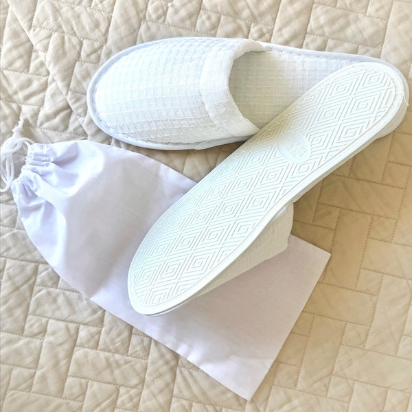 Luxury Waffle Weave Disposable Hotel Slippers with No-Skid PVC Soles with Drawstring Dust Cover Bag| GuestOutfitters.com 